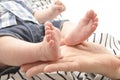 Mother holding a cute baby`s foot closeup