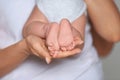 Mother holding feet of her cute little baby in hands Royalty Free Stock Photo