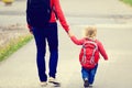 Mother holding hand of little daughter with Royalty Free Stock Photo