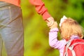 Mother holding hand of little daughter outdoors Royalty Free Stock Photo