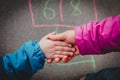 Mother holding hand of little daughter on playground, parenting Royalty Free Stock Photo