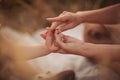 Mother holding hands with her child. Parent play with hands of little kid girl, giving psychological help Royalty Free Stock Photo