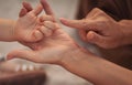 Parent play with hands of little kid girl, giving psychological help. Royalty Free Stock Photo