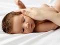 Mother holding head of baby In the safe hands. Mother& x27;s Care. Mom& x27;s Hand Stroking Sleeping Baby& x27;s Royalty Free Stock Photo