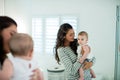 Mother holding her baby girl in the bathroom Royalty Free Stock Photo