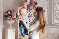 Mother holding her child. Mom playing with laughing kid. Family at home Royalty Free Stock Photo