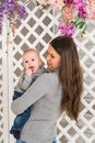 Mother holding her child. Mom playing with laughing kid. Family at home Royalty Free Stock Photo