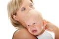 Mother holding her crying baby isolated Royalty Free Stock Photo