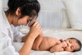 Mother holding her infant baby boy feet on hand Royalty Free Stock Photo