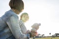 Mother holding her little daughter in her arms in the countryside Royalty Free Stock Photo