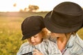 A mother holding her little daughter in her arms in the countryside Royalty Free Stock Photo