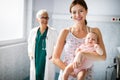 Mother holding her newborn baby child after labor in a hospital Royalty Free Stock Photo