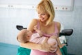 Mother holding her newborn baby child after labor in a hospital Royalty Free Stock Photo