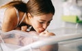 Mother holding her newborn baby child after labor in a hospital Royalty Free Stock Photo