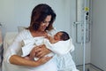 Mother holding her newborn baby child after labor in the ward Royalty Free Stock Photo