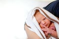 Mother holding her newborn baby daughter after birth on arms. Royalty Free Stock Photo