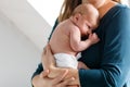 Mother holding her newborn baby daughter after birth on arms. Royalty Free Stock Photo