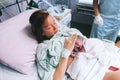 Mother holding her newborn baby after labor in a hospital. Royalty Free Stock Photo