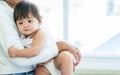 Mother holding and hugging adorable caucasian little baby daughter, playing together, the girl get sick, sleeping staying in