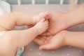 Mother holding little baby feet Royalty Free Stock Photo