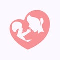 Mother holding little baby in heart shaped silhouette