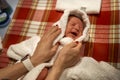 Mother holding little baby wrapped in towel after bath Royalty Free Stock Photo