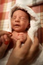 Mother holding little baby wrapped in towel after bath Royalty Free Stock Photo