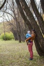 Mother Holding Little Daughter in Autumn Park Royalty Free Stock Photo