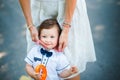 Mother holding little son on the cheek Royalty Free Stock Photo