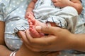 Mother holding new born babies feet Royalty Free Stock Photo
