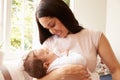 Mother Holding Sleeping Baby Boy At Home Royalty Free Stock Photo