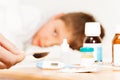 Mother holding spoon with meds for sick kid boy Royalty Free Stock Photo