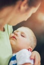 Mother holding to her asleep little son Royalty Free Stock Photo