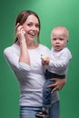 Mother holding toddler son with toy phone Royalty Free Stock Photo