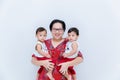 Mother holding two baby Boys. Great happiness, happy young mom with two twins baby. Portrait of young mother holding her little tw Royalty Free Stock Photo