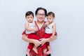 Mother holding two baby Boys. Great happiness, happy young mom with two twins baby. Portrait of young mother holding her little tw Royalty Free Stock Photo