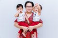 Mother holding two baby Boys. Great happiness, happy young mom with two twins baby. Portrait of young mother holding her little tw Royalty Free Stock Photo