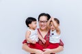 Mother holding two baby Boys. Great happiness, happy young mom with two twins baby. Portrait of young mother holding her little tw Royalty Free Stock Photo