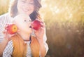 Mother holding two red ripe apples. Child (baby boy, kid) eating healthy food, snack. Royalty Free Stock Photo