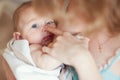 Mother holdingnewborn baby on hands and play