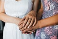 Mother holds her daughter bride by the hands on the wedding day Royalty Free Stock Photo