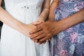 Mother holds her daughter bride by the hands on the wedding day Royalty Free Stock Photo