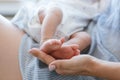 Mother holds legs newborn baby Royalty Free Stock Photo