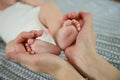 Tenderness in the touch of a mother`s hands to her child. Royalty Free Stock Photo