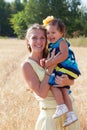 Mother holds the little daughter on hands