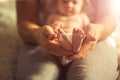 Mother holds newborn baby`s feets. Tiny feet in woman`s hand. Royalty Free Stock Photo