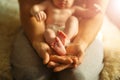 Mother holds newborn baby`s feets. Tiny feet in woman`s hand. Royalty Free Stock Photo