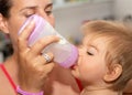 Feeding. Mother. Baby. Eating. Bottle. Cute Royalty Free Stock Photo