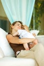 Mother hugging baby at terrace Royalty Free Stock Photo