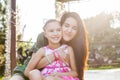 Mother hugging daughter with closen eyes Royalty Free Stock Photo